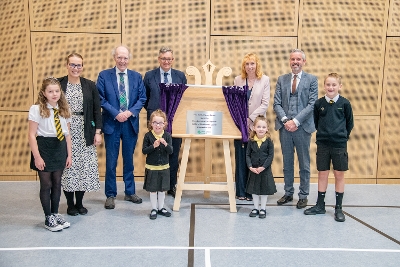 East Calder Primary official opening Pupils, staff and invited guests with the plaque to mark the official opening of the new East Calder Primary
