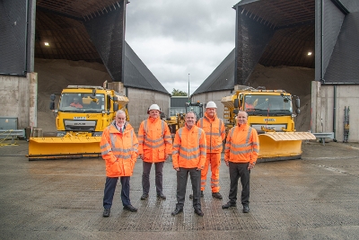 Winter Ready Cllr Conn and council staff with snow ploughs at salt domes