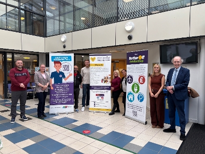 Council and partner staff at Challenge Poverty event with Council Leader Lawrence Fitzpatrick